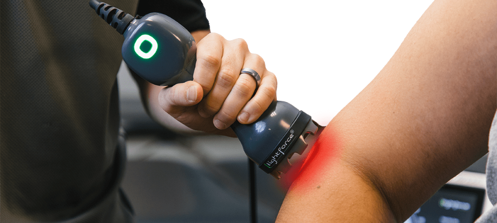 lightforce laser used on patient elbow