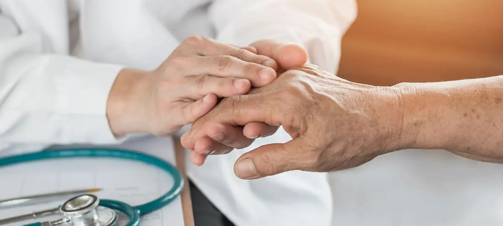 doctor evaluating hand of patient