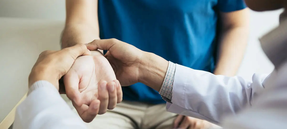 doctor feeling patient's wrist