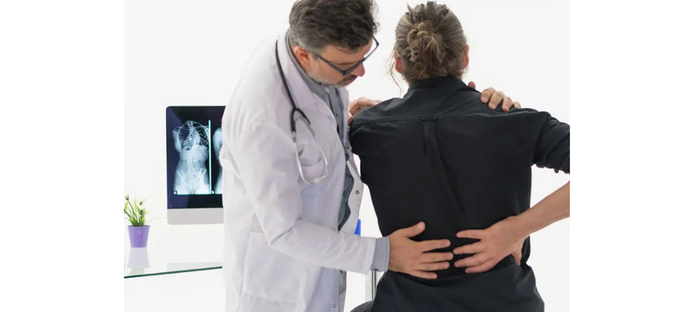 doctor with patient with back pain