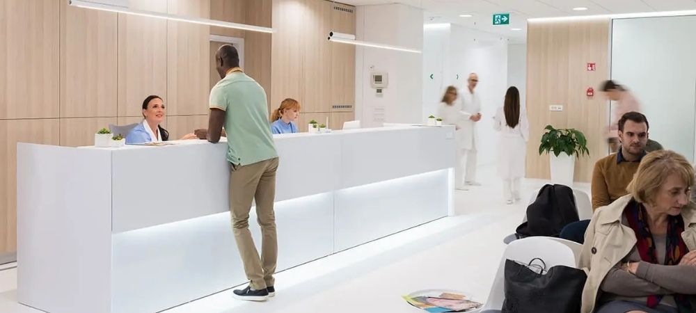 person at the counter in a doctor's office