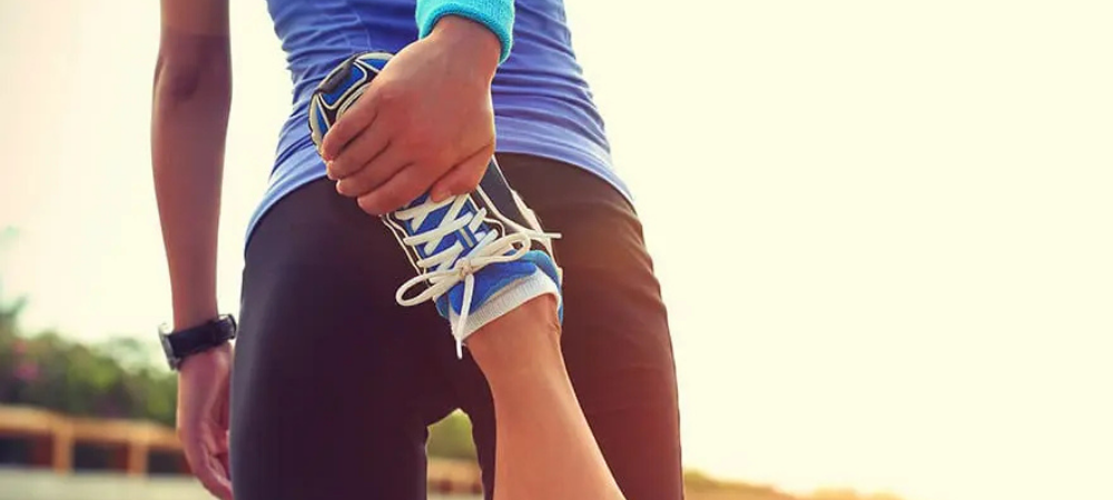 runner stretching leg