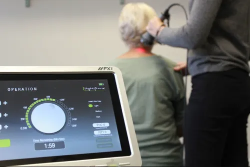 FXi Elderly Lady Laser Treatment.png